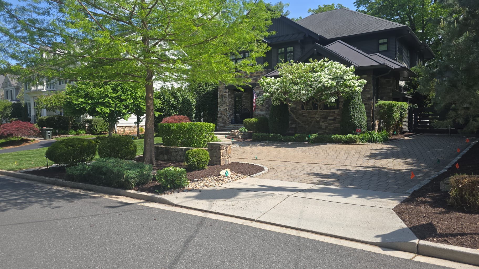 Beautiful upscale residential landscaping with manicured lawn and professional design